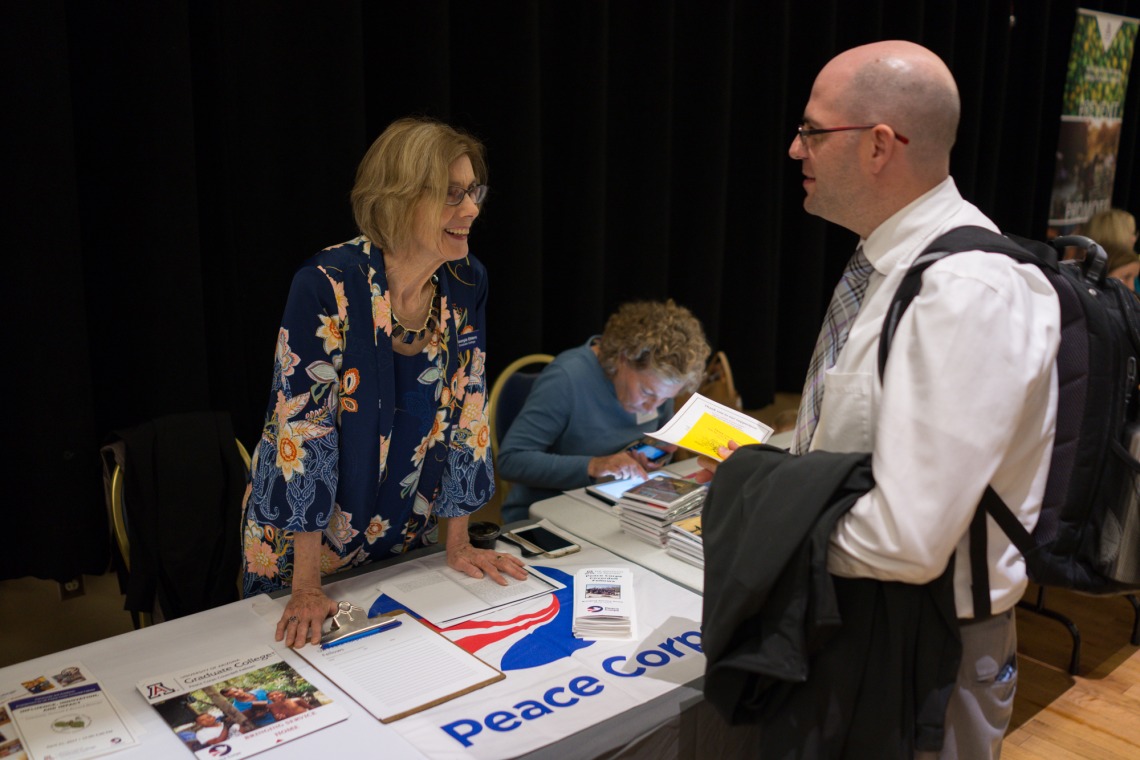 Program Director at the Peace Corps table