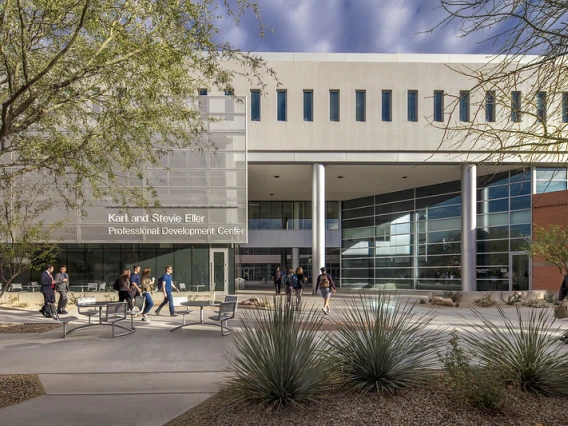 Students walking on campus at Eller College of Management. 