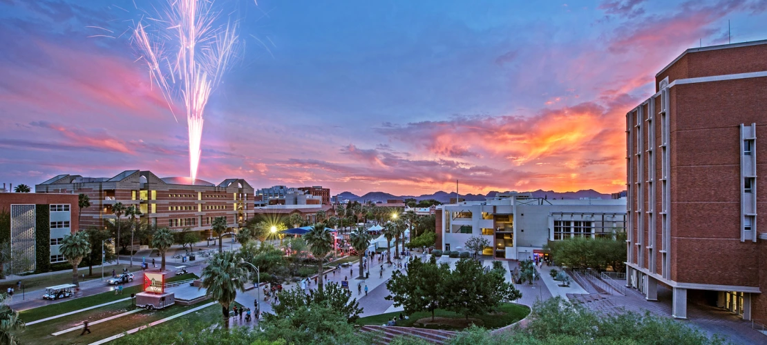 Sunset view of UArizona Campus with Fireworks in the Distance