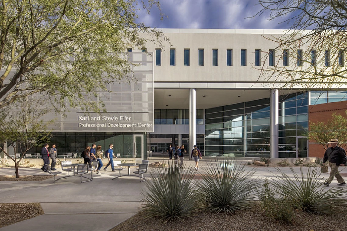 Students walking on campus at Eller College of Management. 