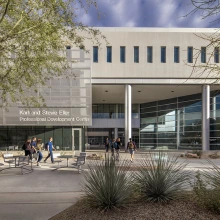 Students walking on campus at Eller College of Management. 
