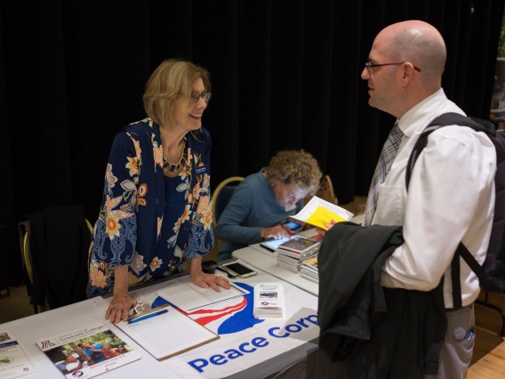 Program Director at the Peace Corps table