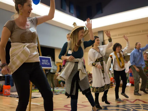 Fellows dancing at Peace Corps Fair