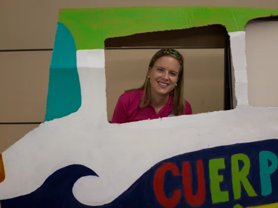 A Fellow in a Central American bus display at Peace Corps Fair