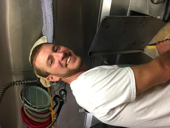 Coverdell Fellows clean up after preparing a meal for Primavera Men's Shelter