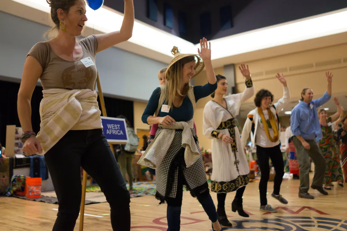 Fellows dancing at Peace Corps Fair