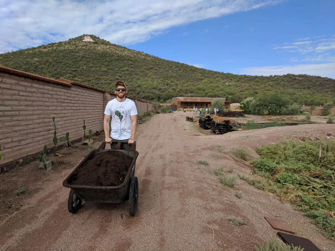 Coverdell Fellows fertilize crops at Mission Garden