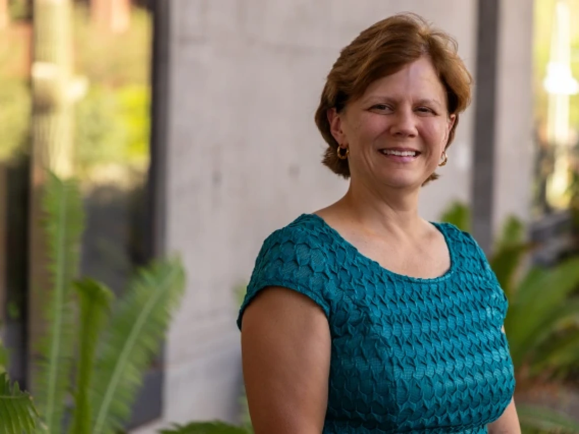 Picture of Dr. Panferov Reese in front of green foliage