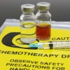 Image of syringe, two vials and a yellow chemotherapy waste bag